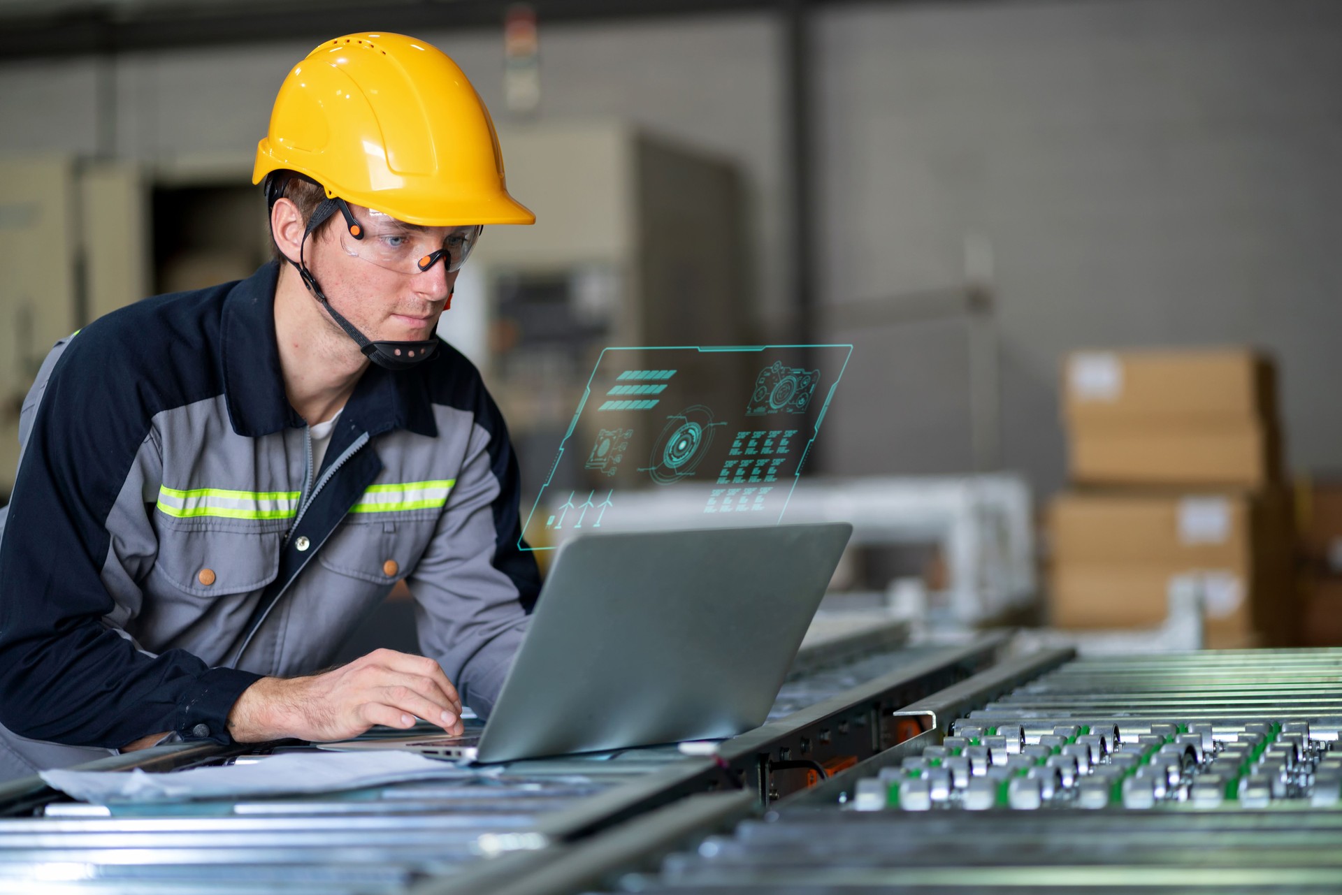 A robotics engineer closely monitors the progress of installation program for robotic arm via a digitization display, ensuring precision in the manufacturing of a robotic arm part. Integration of advanced technology and human expertise in an automated